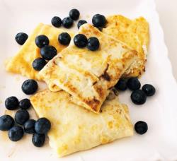 Blintzes with fresh blueberry topping